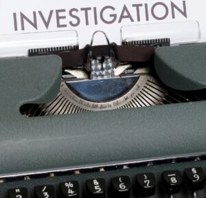 House Buying Negotiation Tactics for Denver Home Buyers - Picture of a Typewriter which Reads Investigations